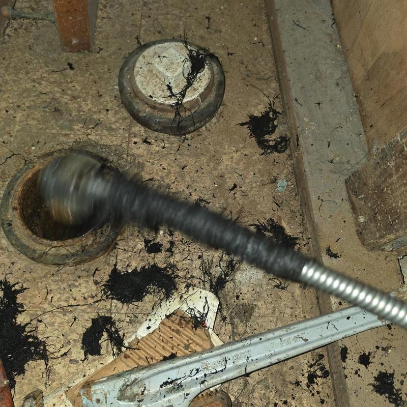 Main sewer line cleaning with root removal near cleanout