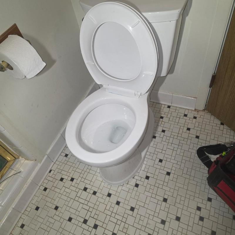 Toilet with replaced fill valve and reset base