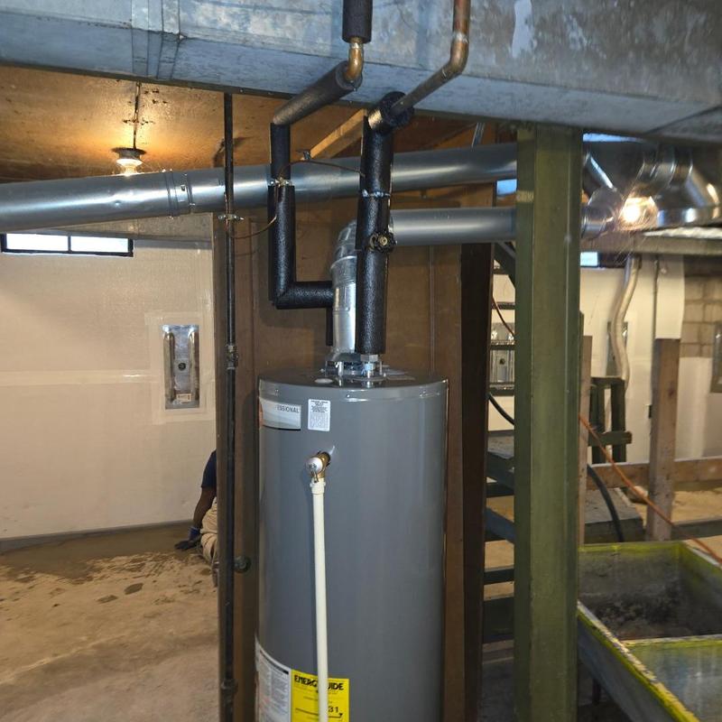 Water heater with insulation and vent piping installation
