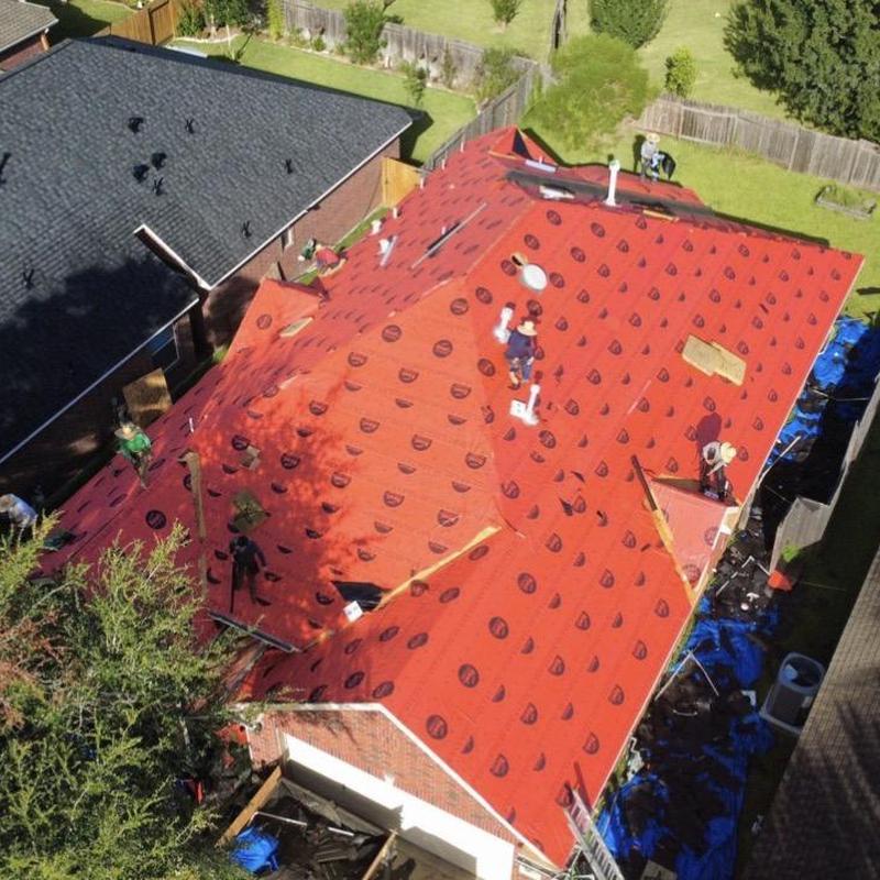 Roof underlayment installation on residential home