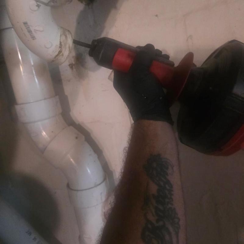 PVC drain pipe clearing with power auger drill