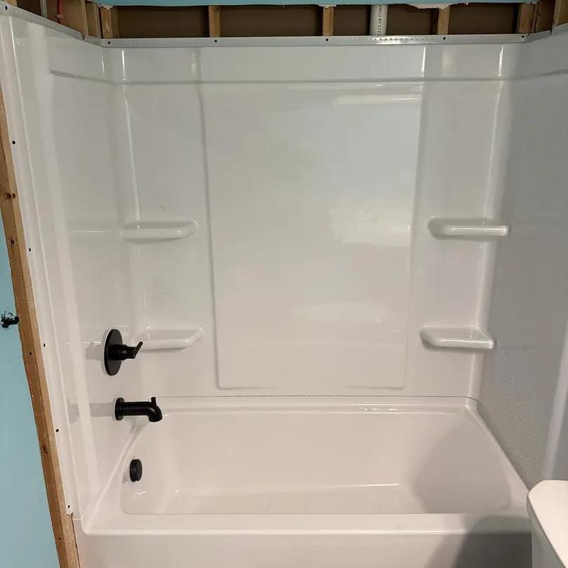 Tub-shower insert with black fixtures installation