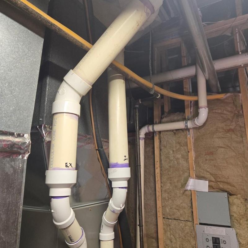 PVC drain pipes with joints in basement utility area
