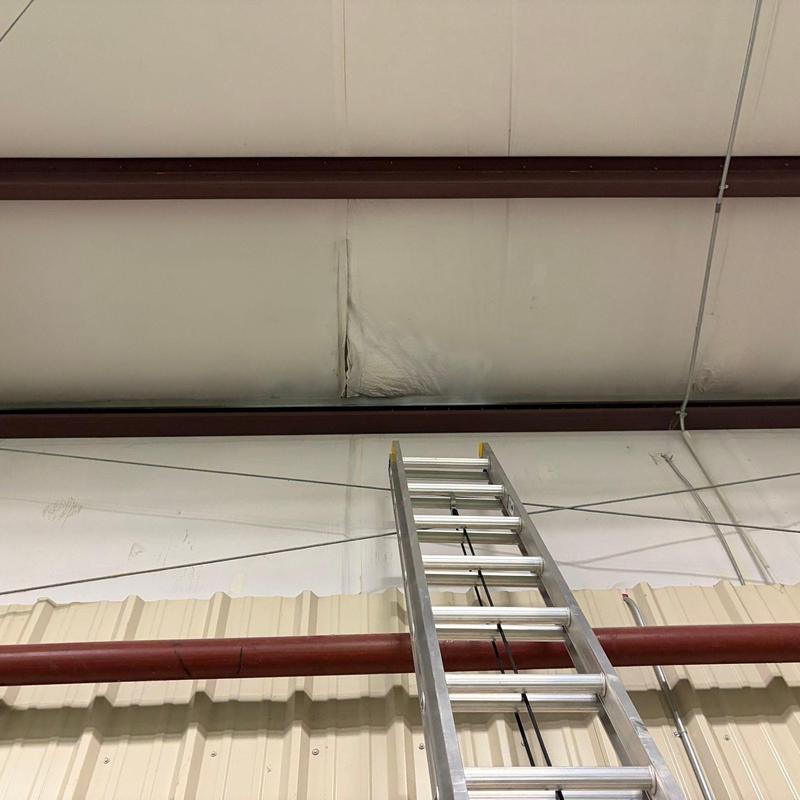 Spray foam ceiling insulation with visible damage