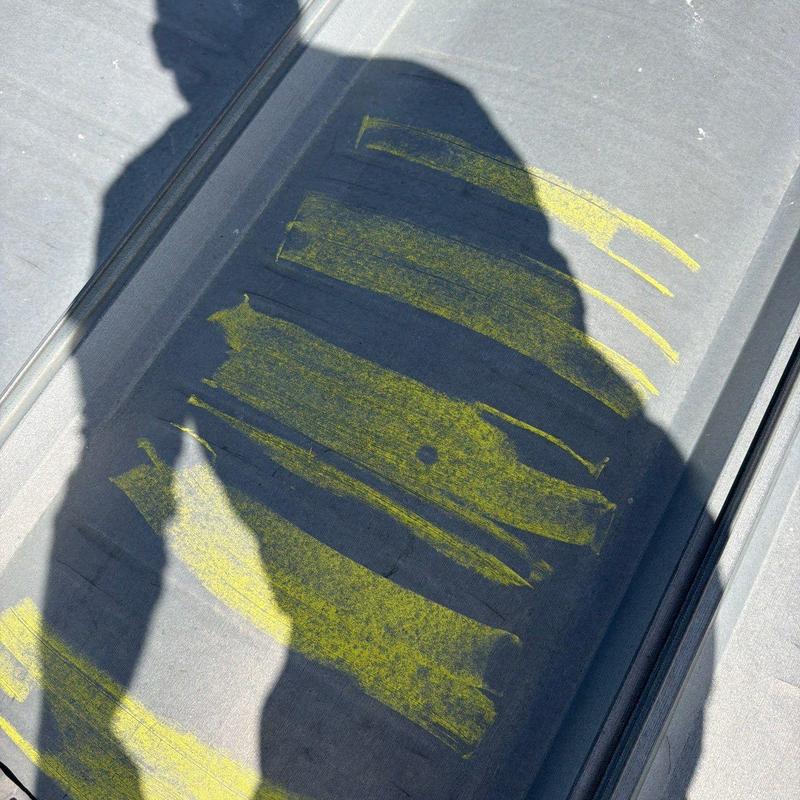Metal roof hail damage marked with yellow chalk
