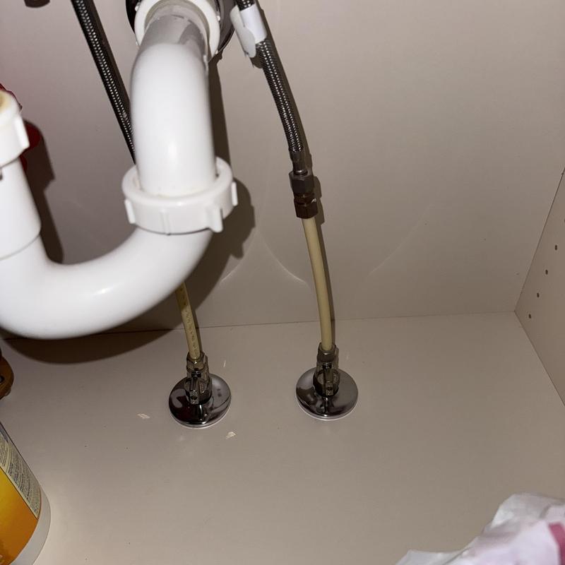 Faucet shutoff valves and supply lines under sink Faucet shutoff valves and supply lines under sink