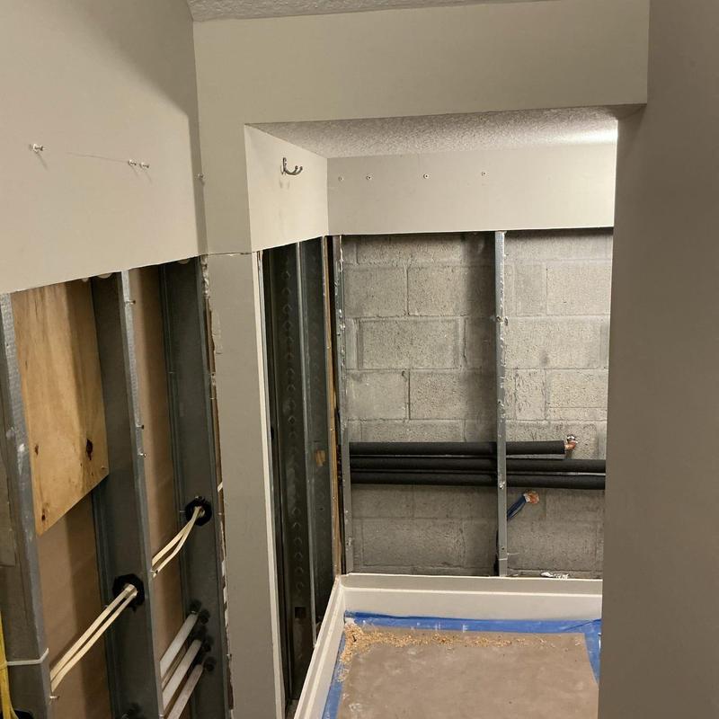 Uponor PEX piping installation behind bathroom wall Uponor PEX piping installation behind bathroom wall