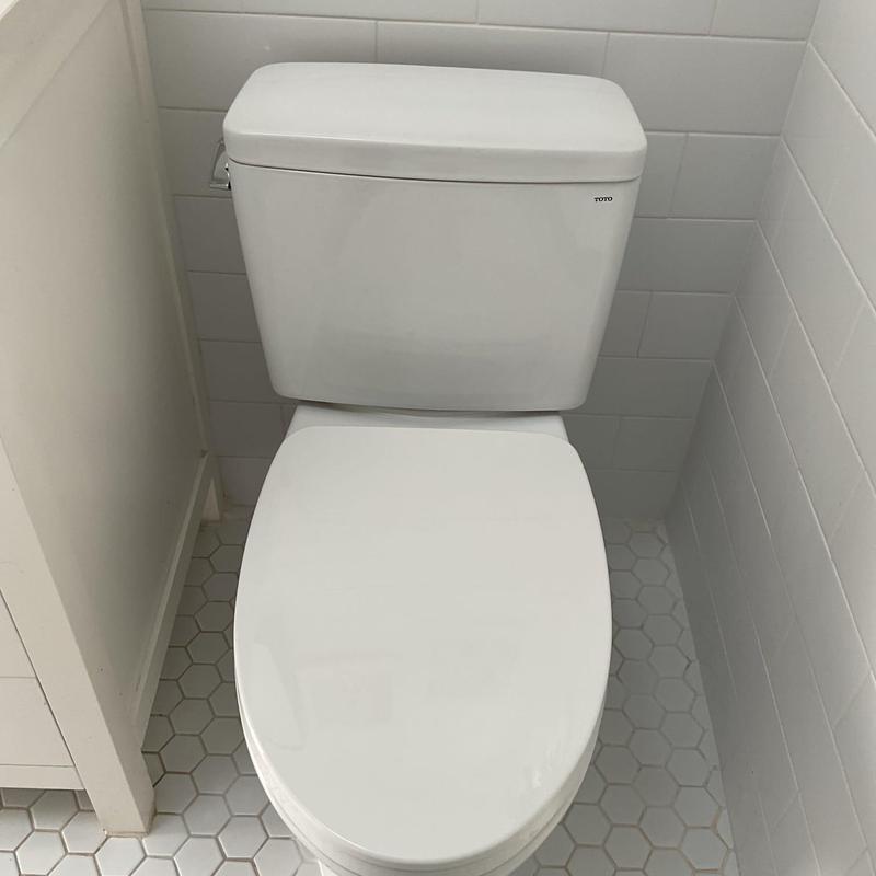 TOTO Drake two-piece toilet installed in bathroom corner TOTO Drake two-piece toilet installed in bathroom corner