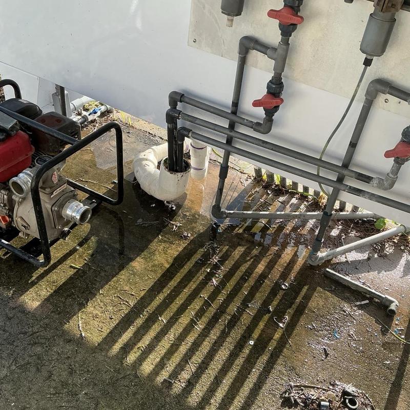 Outdoor drain pipe with water pump and piping system
