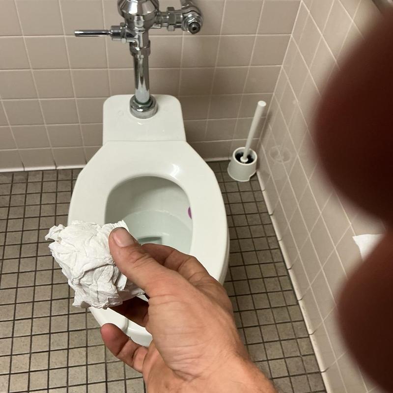 Toilet flapper adjusted in employee bathroom