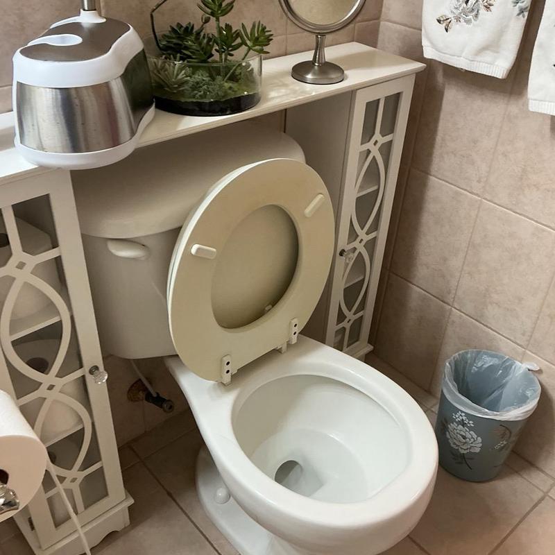 Toilet with open seat in residential bathroom