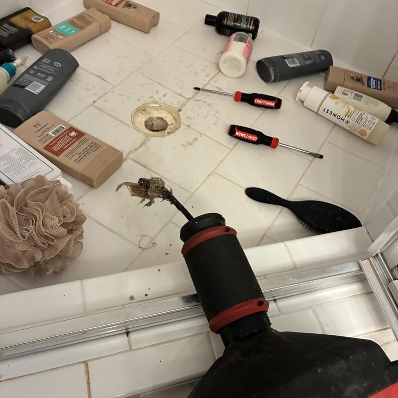 Shower drain clog removal with sewer machine
