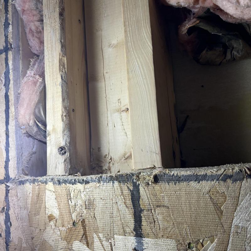 Cast-iron shower base seam leak behind wall studs