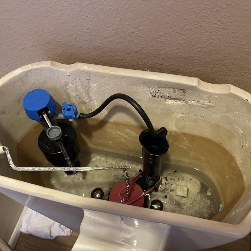 Toilet tank fill valve and flush valve installation