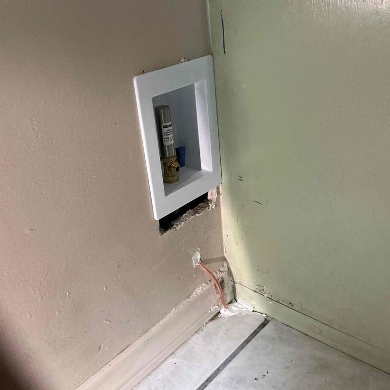 Ice maker valve enclosure with compression fittings