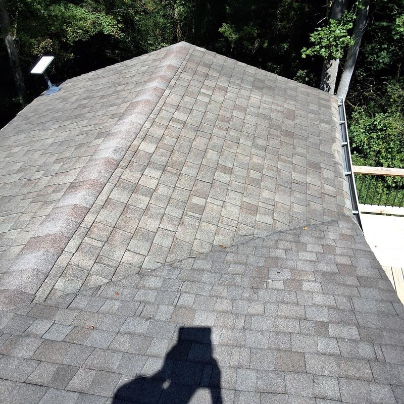 Roof ridge ventilation with asphalt shingles on peak Roof ridge ventilation with asphalt shingles on peak