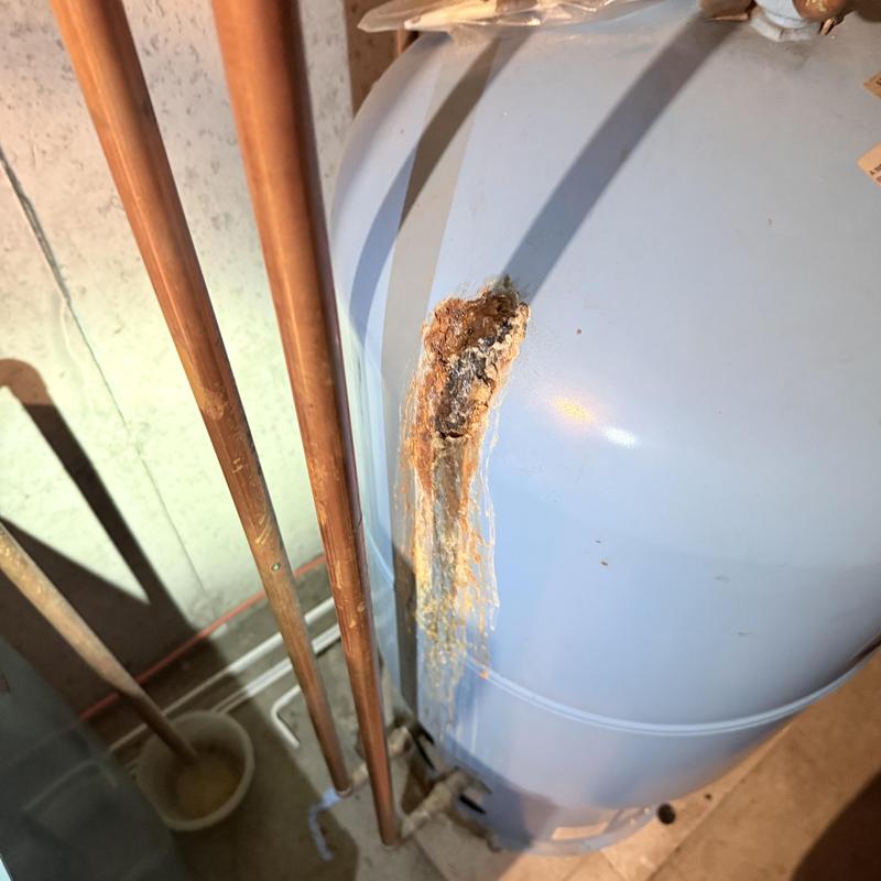 Water heater tank with rust corrosion and leaks