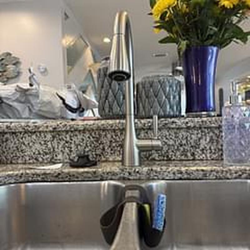 Kitchen faucet with granite countertop and sink