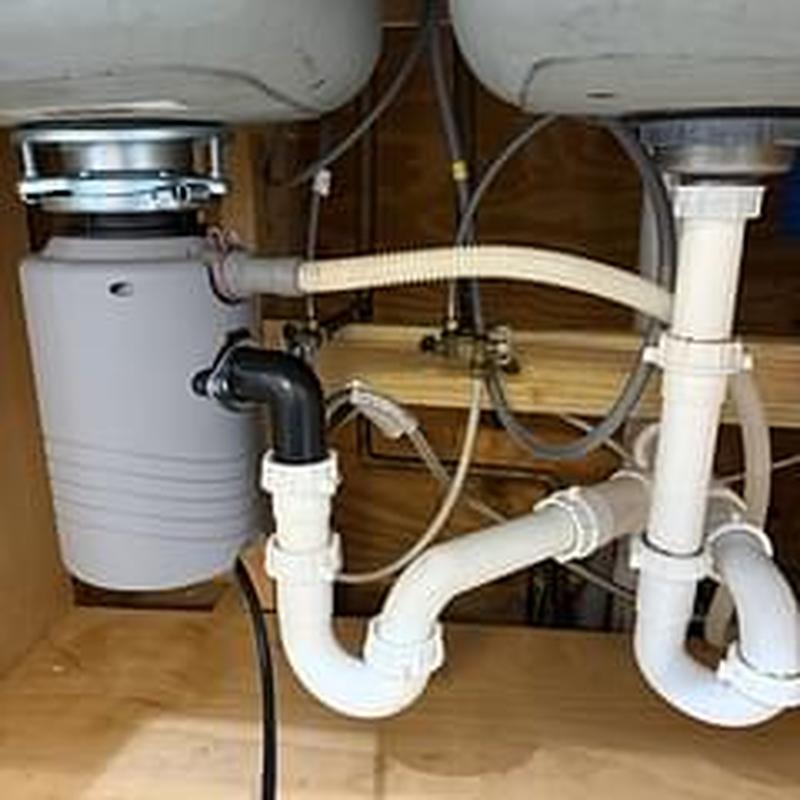 Garbage disposal and kitchen sink plumbing secured