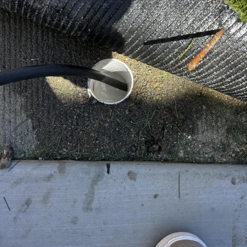 Area drain line cleaning with hose insertion outdoors