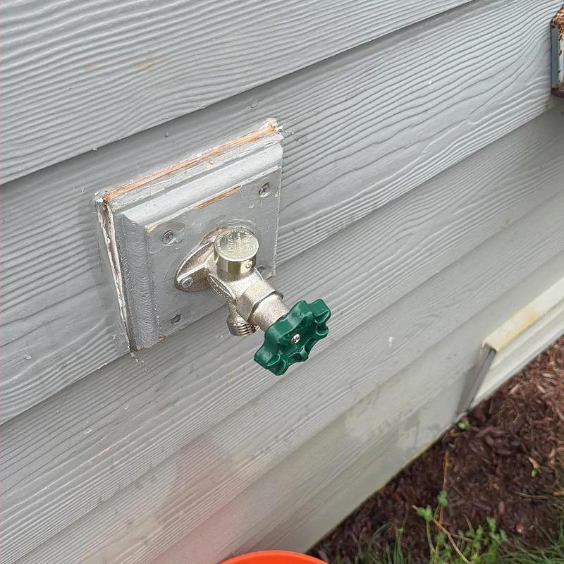 Frost-free hose bib valve installed on exterior wall