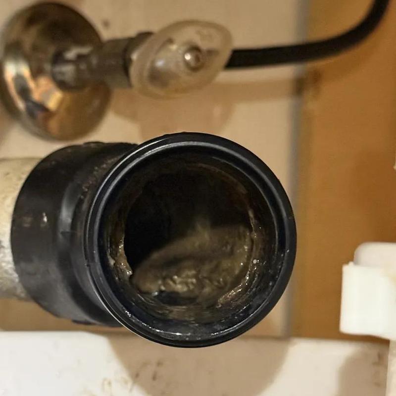 Drain pipe with grease blockage inside under sink