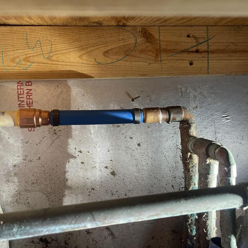 Copper water supply pipe with PEX transition fitting Copper water supply pipe with PEX transition fitting