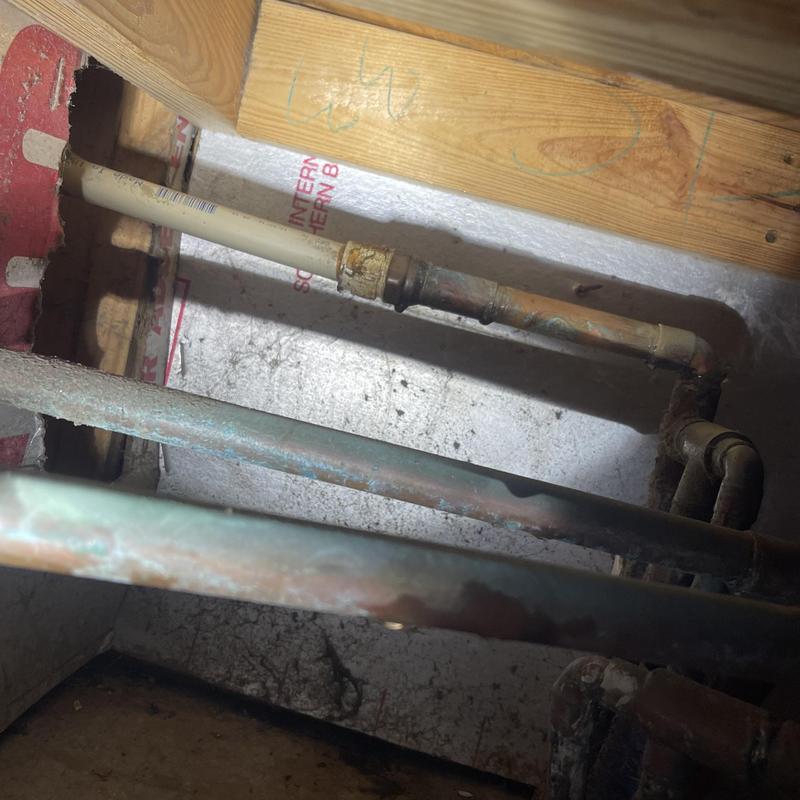 Copper and PVC plumbing pipes inside wall cavity Copper and PVC plumbing pipes inside wall cavity