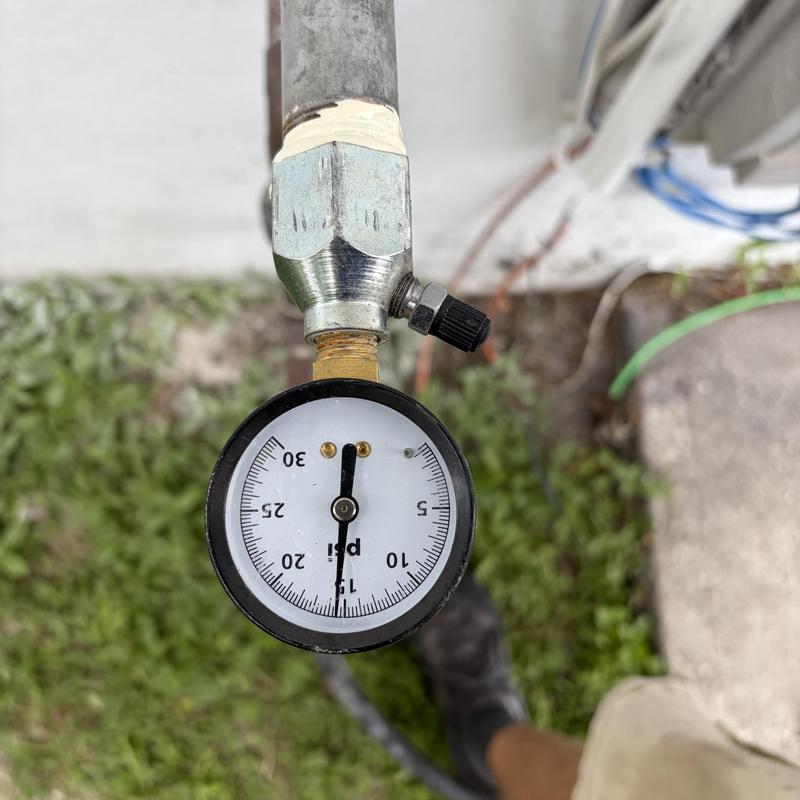Gas pressure gauge on outdoor piping system