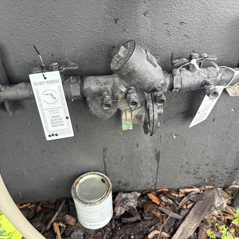 Backflow preventer valve with inspection tags outdoors