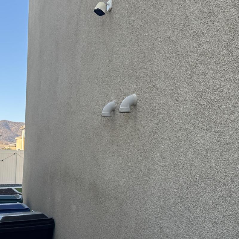 Navien heat exchanger vent pipes on exterior wall Navien heat exchanger vent pipes on exterior wall