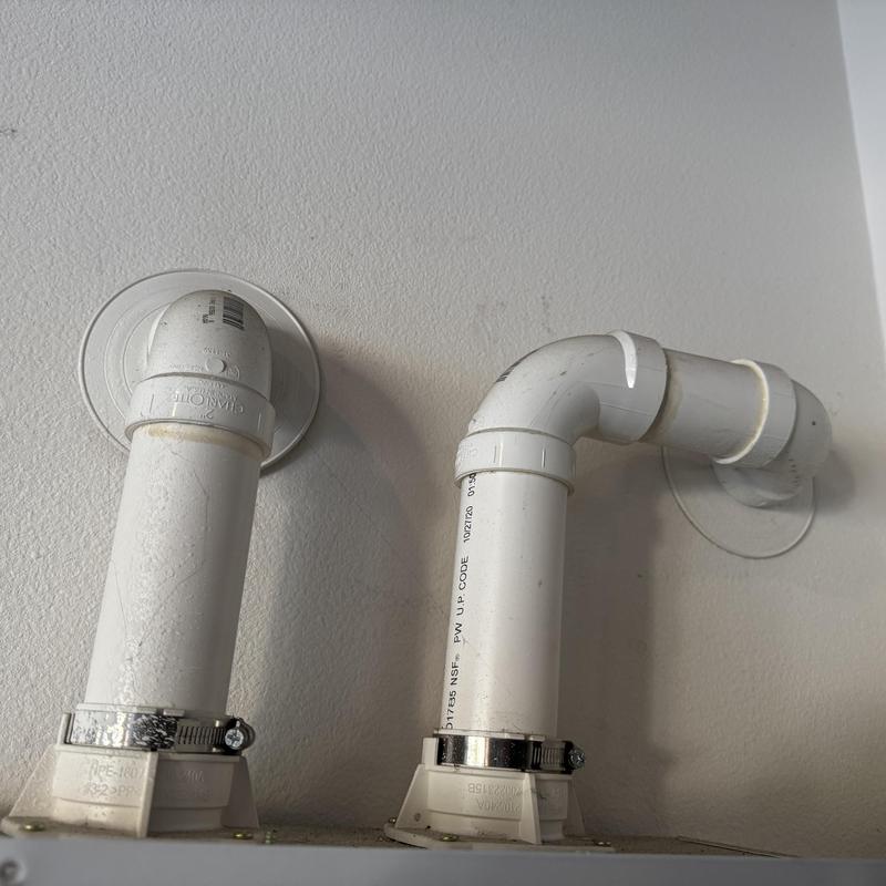 Navien heat exchanger PVC vent pipes mounted on wall Navien heat exchanger PVC vent pipes mounted on wall