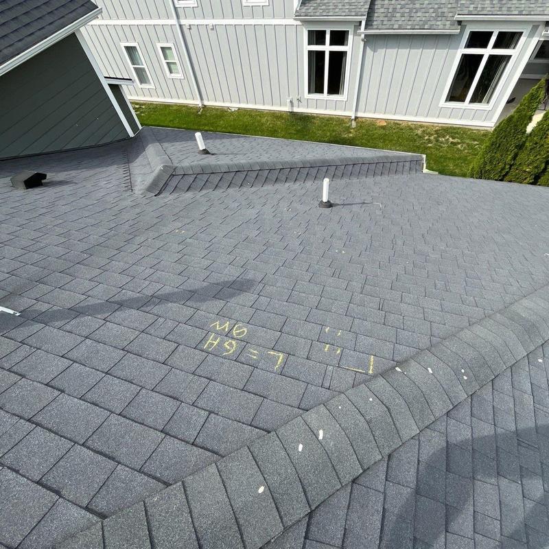 Asphalt shingle roof with hail damage markings
