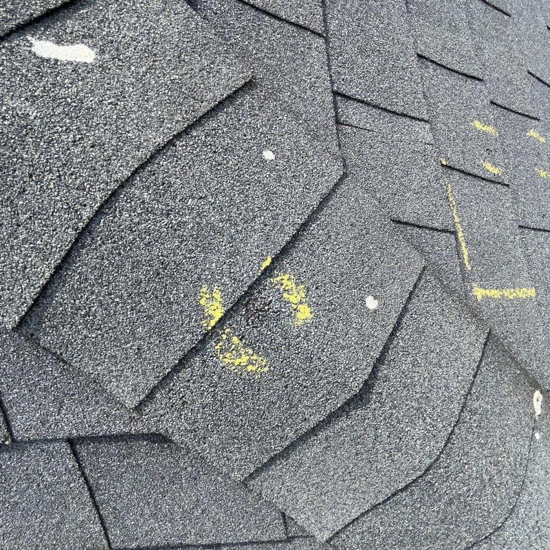 Asphalt shingles with hail damage markings