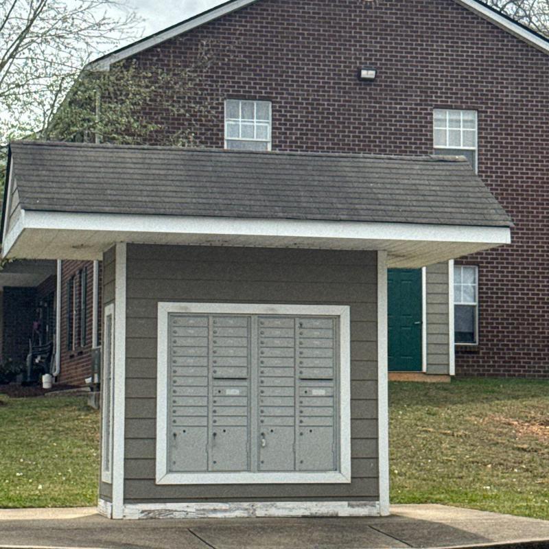 Community mailbox structure with shingled roof