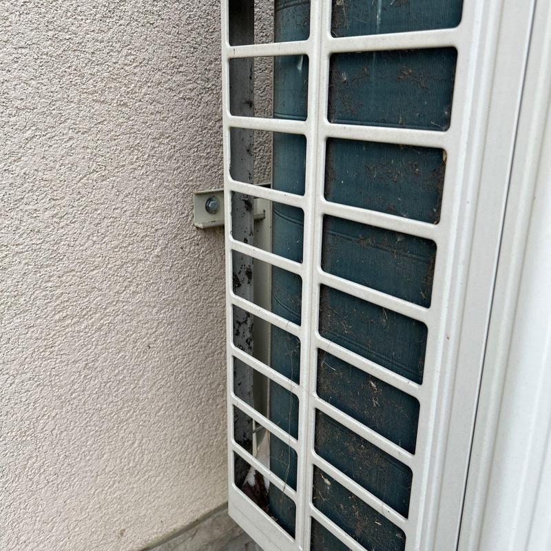 Air conditioner condenser coil with dirt buildup