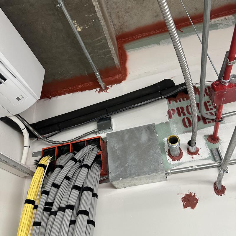 Mini split AC unit with electrical conduit and cables Mini split AC unit with electrical conduit and cables