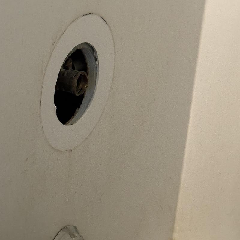 Shower valve with old cartridge removed in wall cavity Shower valve with old cartridge removed in wall cavity