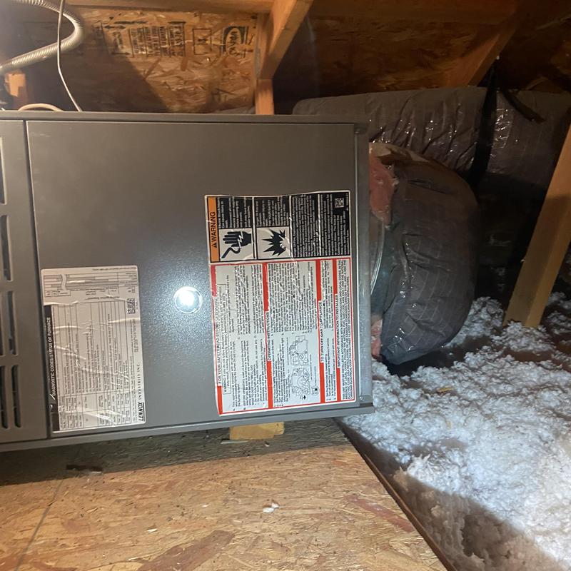 HVAC furnace unit in insulated attic space HVAC furnace unit in insulated attic space