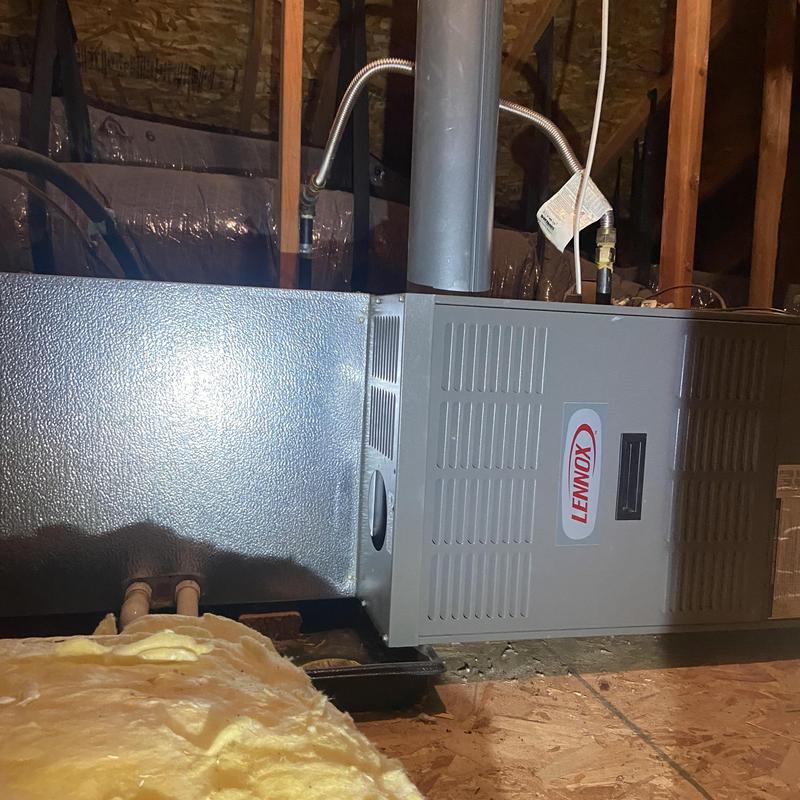 Lennox HVAC furnace unit installed in attic space Lennox HVAC furnace unit installed in attic space