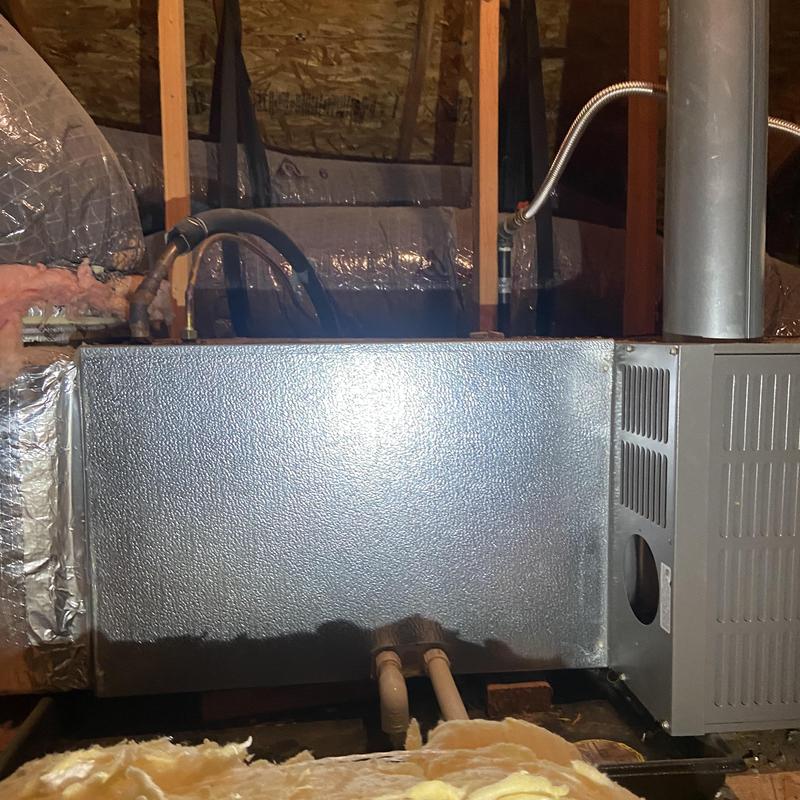 HVAC furnace unit in attic with ductwork and insulation HVAC furnace unit in attic with ductwork and insulation