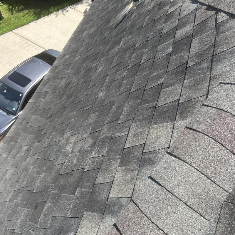 Asphalt shingle roof surface close-up inspection in Pearland