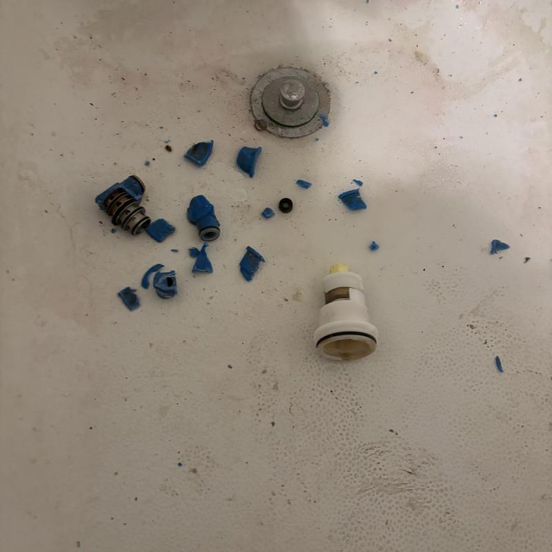 Delta shower cartridge pieces on tub floor Delta shower cartridge pieces on tub floor