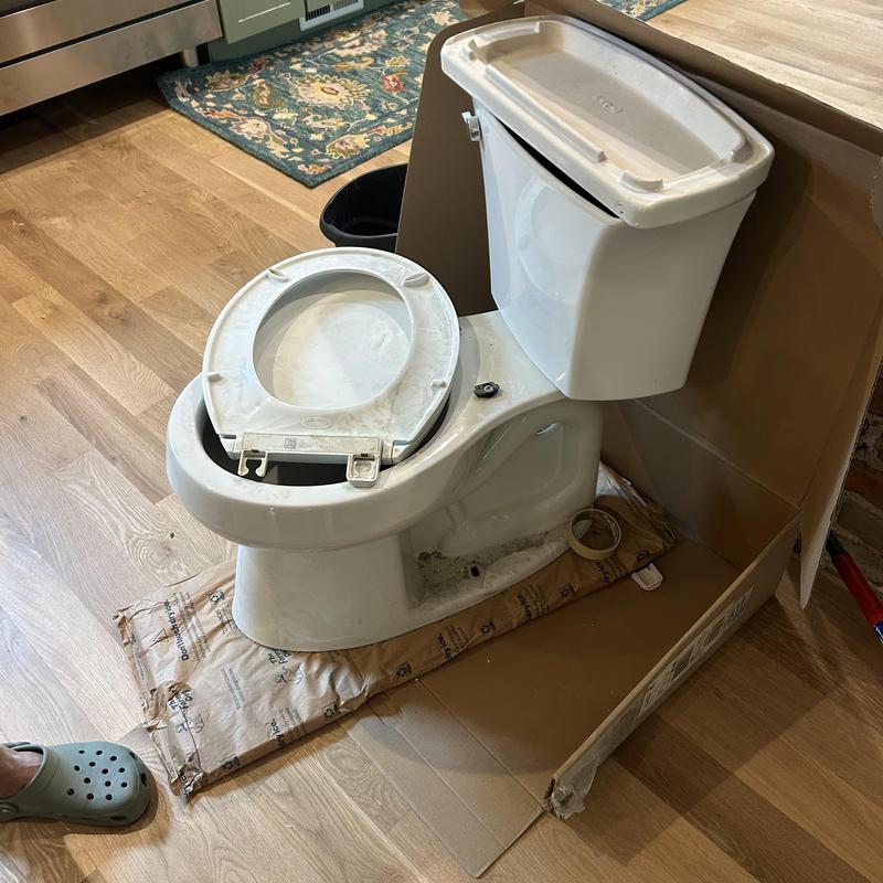 Toilet unit removed for reset estimate in kitchen area