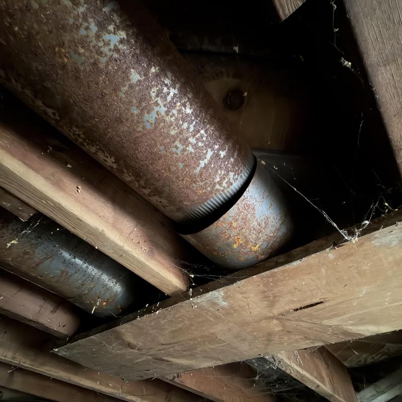 Galvanized ductwork with rust and disconnect in crawlspace Galvanized ductwork with rust and disconnect in crawlspace
