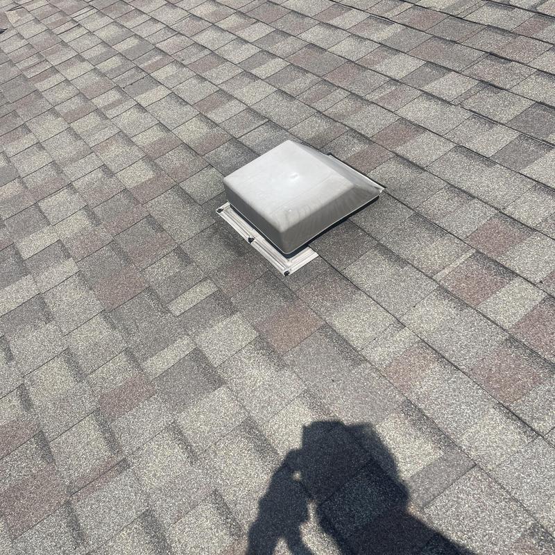 Roof vent flashing and shingle roof surface Roof vent flashing and shingle roof surface