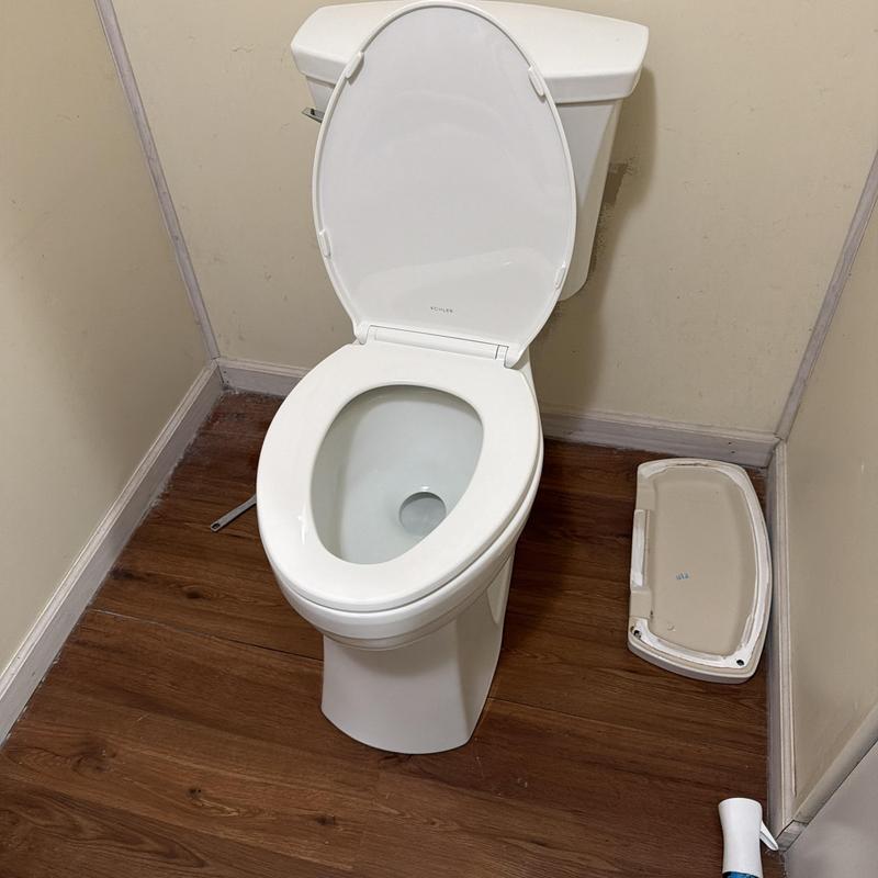 Toilet installation with customer-supplied fixture in bathroom Toilet installation with customer-supplied fixture in bathroom