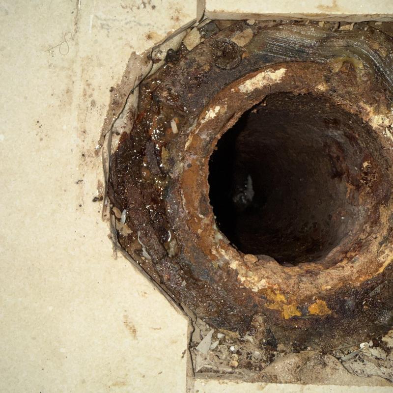 Toilet flange with rust and corrosion damage