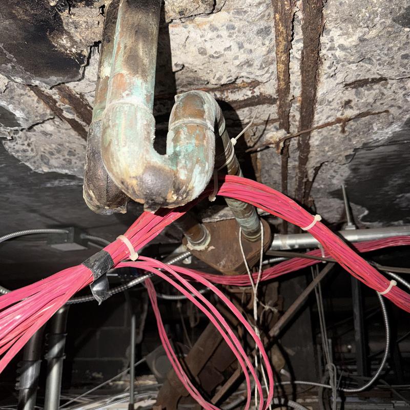 Bathroom tub drain pipe with electrical wiring bundles Bathroom tub drain pipe with electrical wiring bundles
