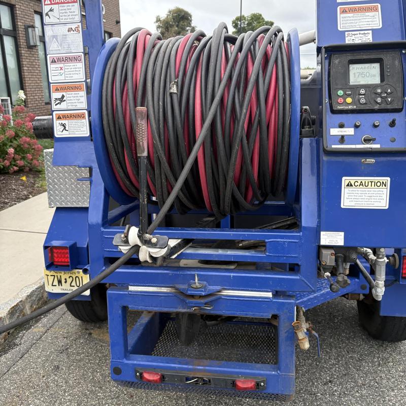 Hydro-jet cleaning machine with hose reel on trailer Hydro-jet cleaning machine with hose reel on trailer